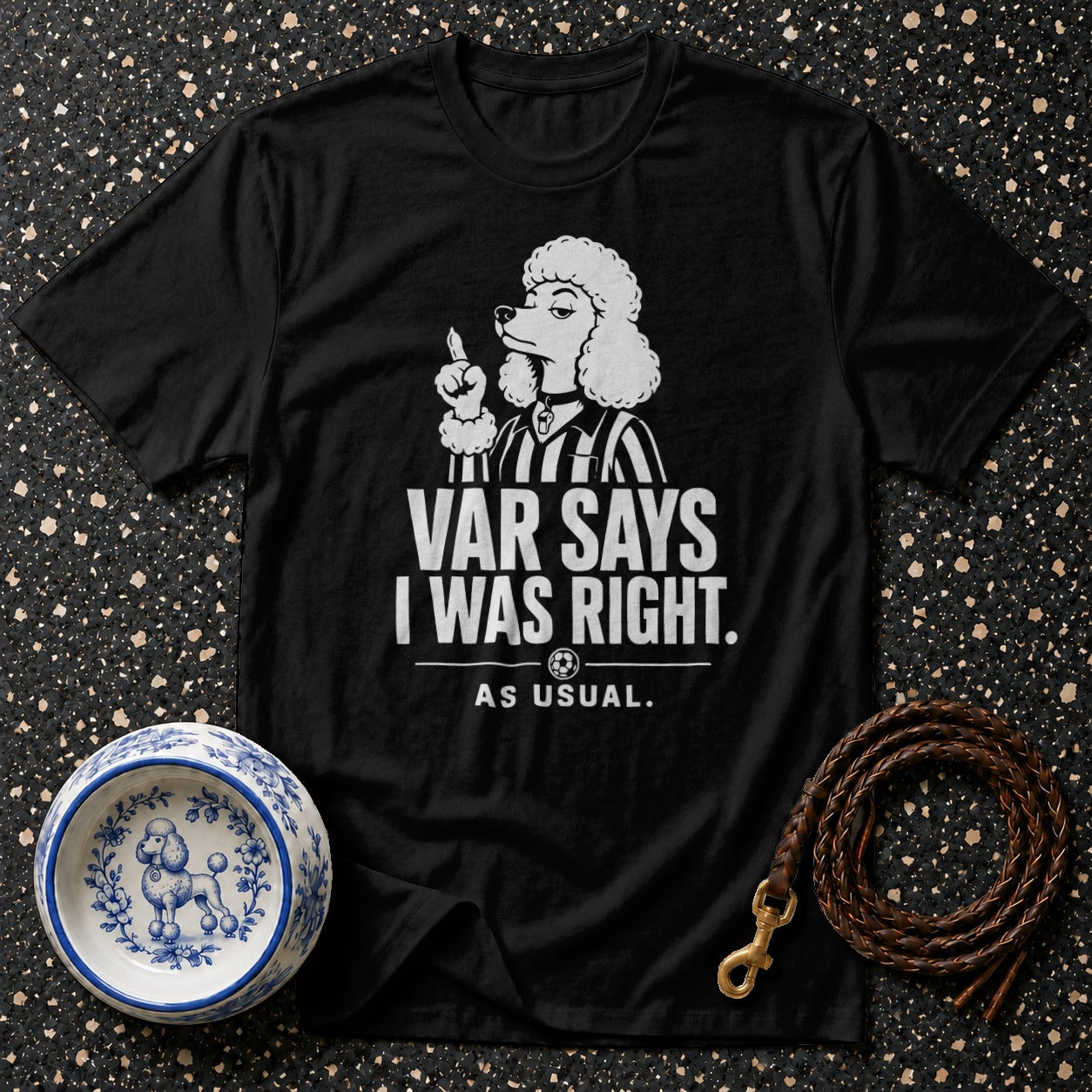 Black t-shirt with a white graphic of a poodle referee saying "VAR SAYS I WAS RIGHT. AS USUAL."