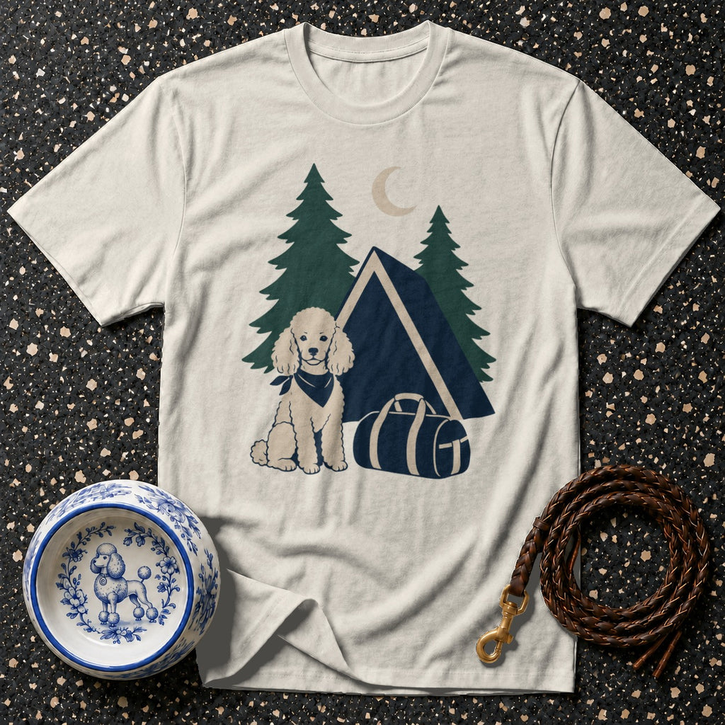 Cream t-shirt with a cartoon poodle wearing a bandana in a camping scene.