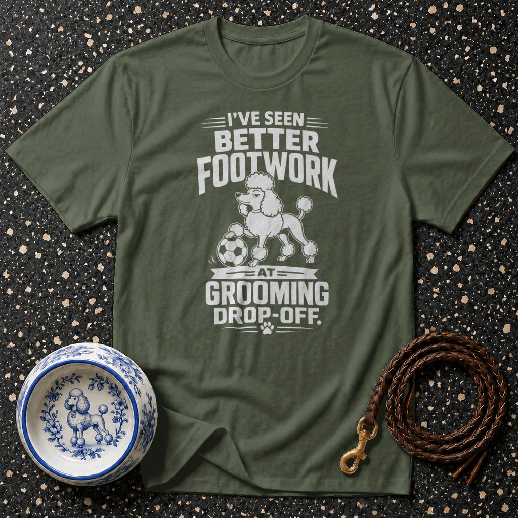 Green t-shirt with white graphic: "I've Seen Better Footwork At Grooming Drop-Off."