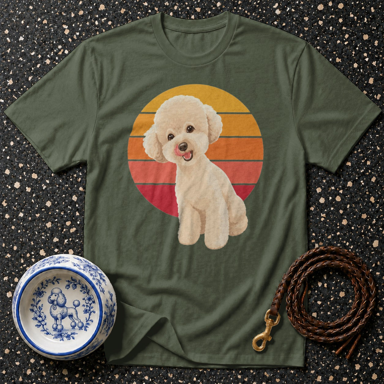 Green t-shirt with a cream poodle design on a striped sunset circle.