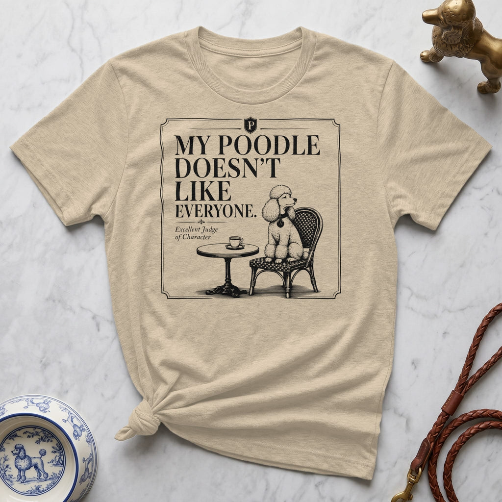 Beige t-shirt with "My Poodle Doesn't Like Everyone" text and poodle illustration.