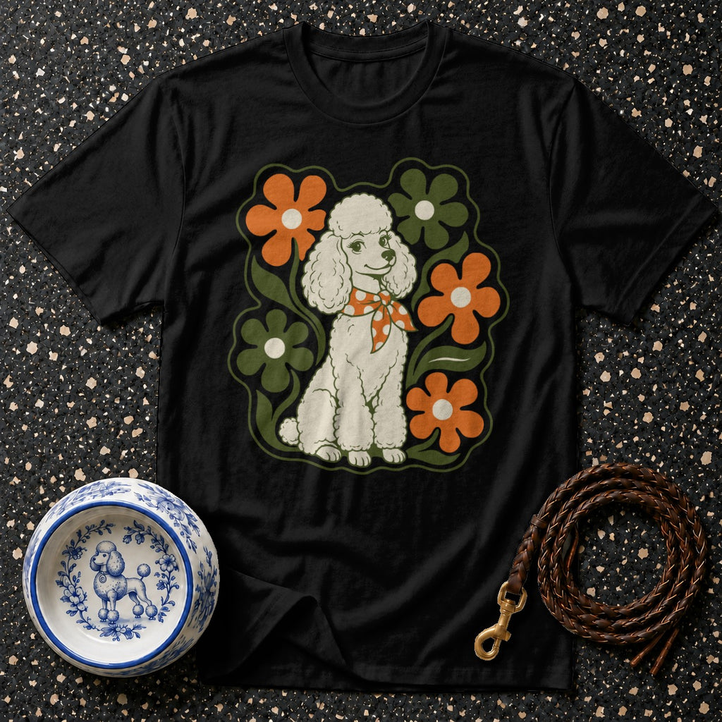 Black t-shirt featuring a white poodle wearing a patterned bandana, surrounded by flowers.