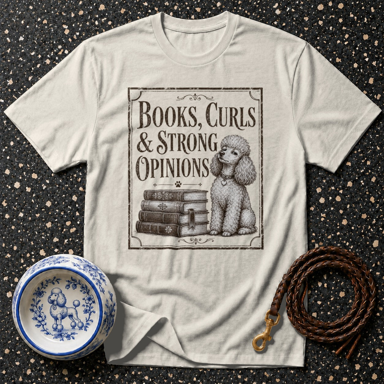T-shirt with "Books, Curls & Strong Opinions" text, a poodle, and books.