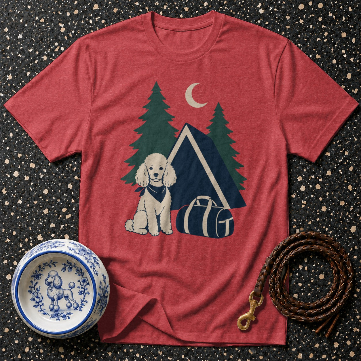 Red t-shirt with poodle camping graphic, dog bowl, and braided leash.
