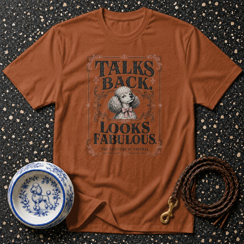 Brown t-shirt with poodle graphic and text: "TALKS BACK. LOOKS FABULOUS. THE ATTITUDE IS NATURAL."