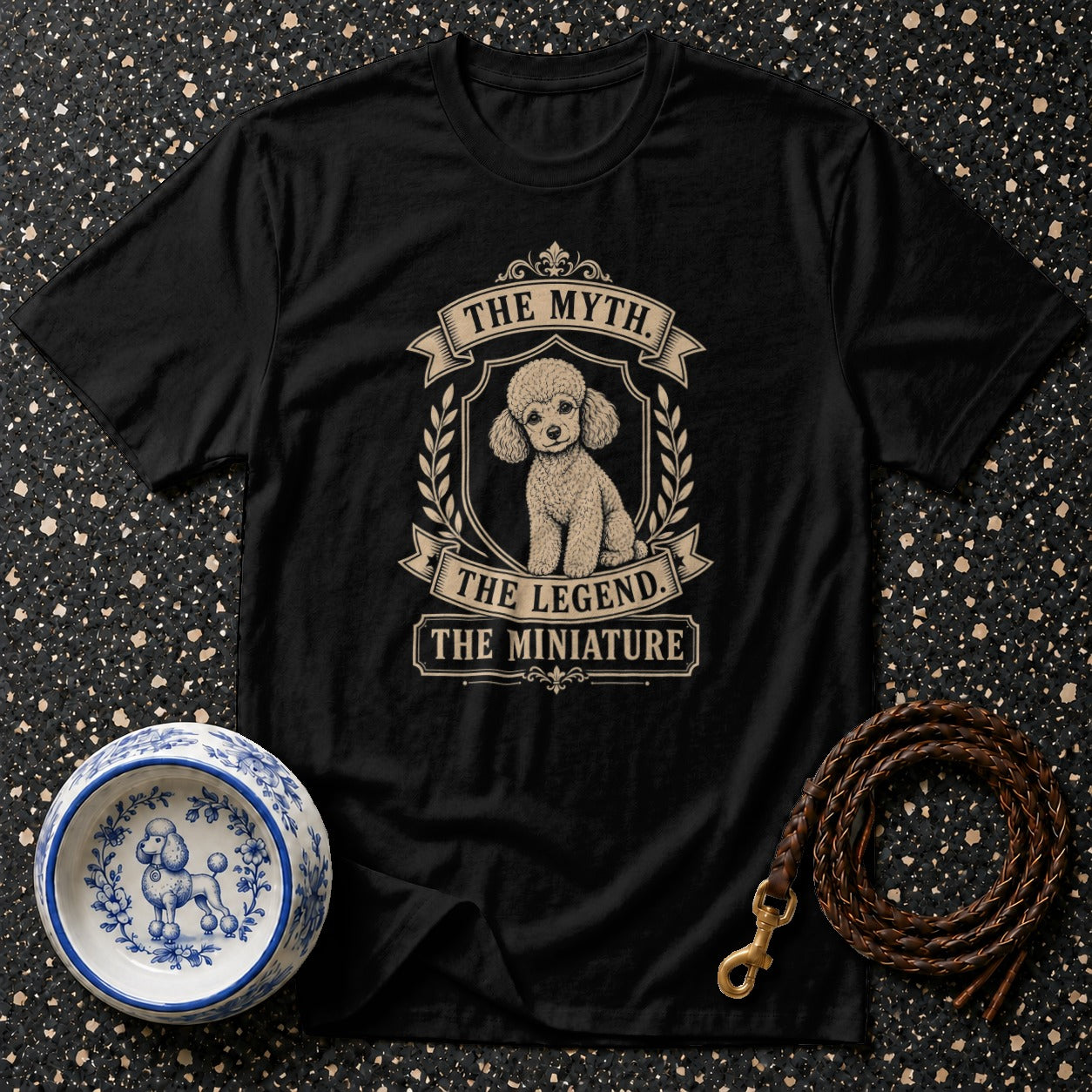 Black t-shirt with a poodle graphic and text: "The Myth. The Legend. The Miniature."