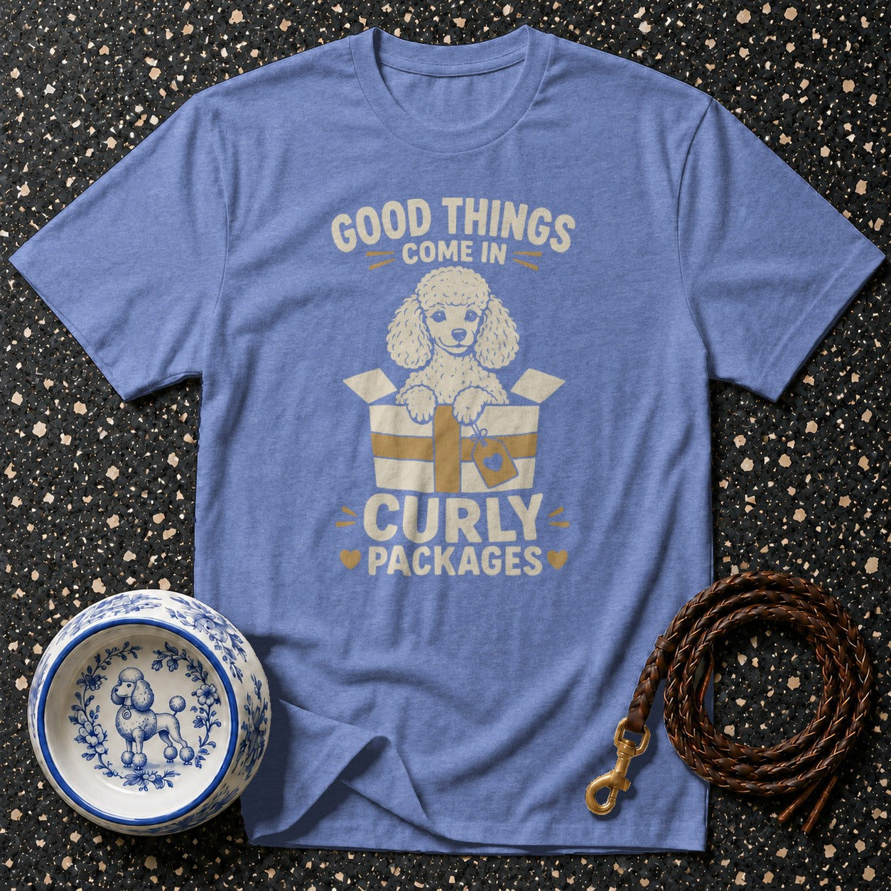 Blue t-shirt with a poodle in a box and text "Good Things Come in Curly Packages".