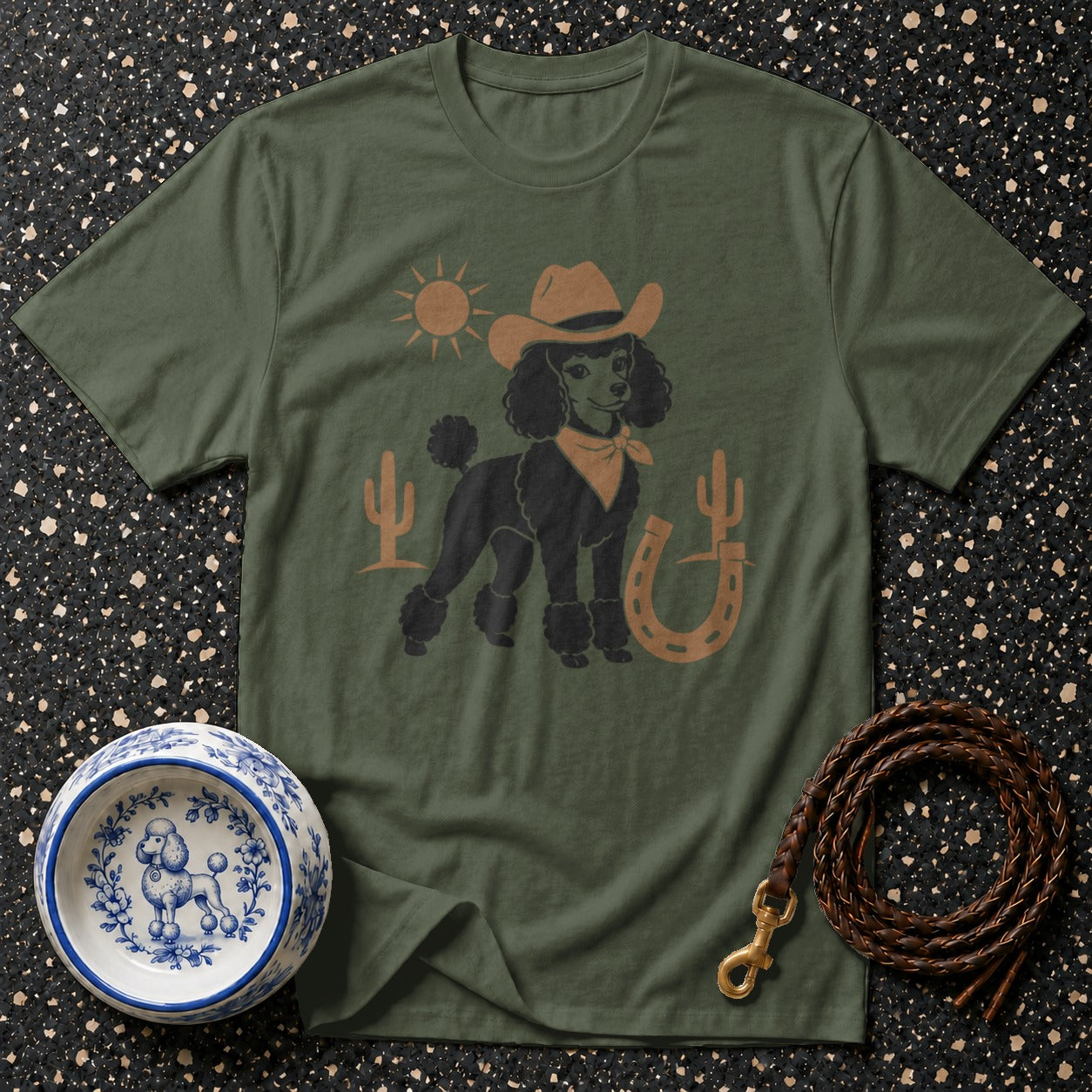 T-shirt with cowboy poodle graphic, sun, cacti, and horseshoe.