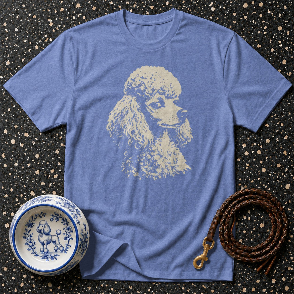 Blue t-shirt with a cream poodle graphic, ceramic dog bowl, and leather leash.