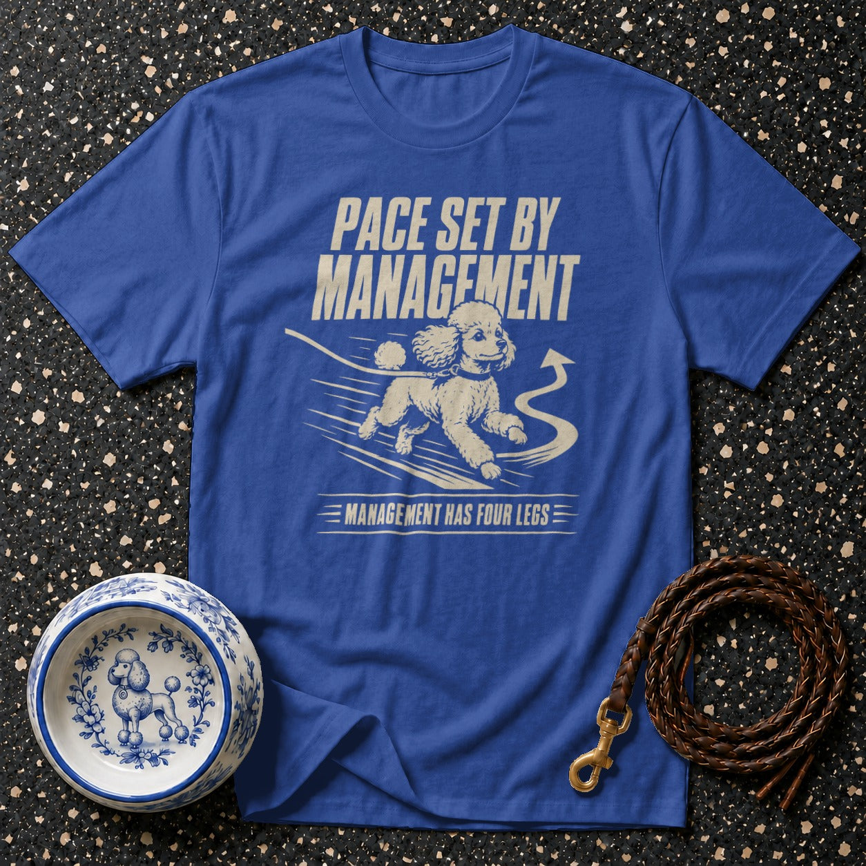 Blue t-shirt with graphic of a running poodle and text "Pace Set By Management" and "Management Has Four Legs".