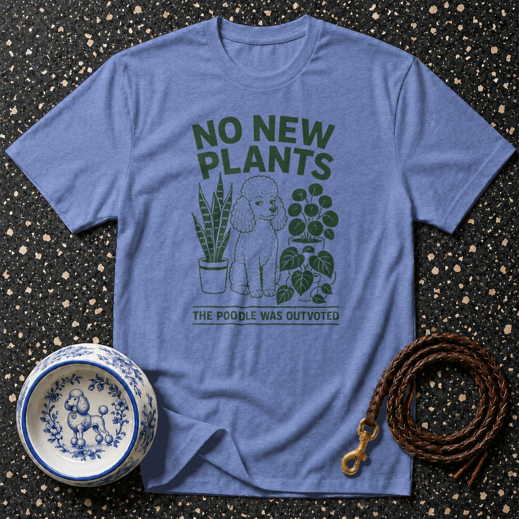 Blue t-shirt with green text and poodle graphic surrounded by plants.