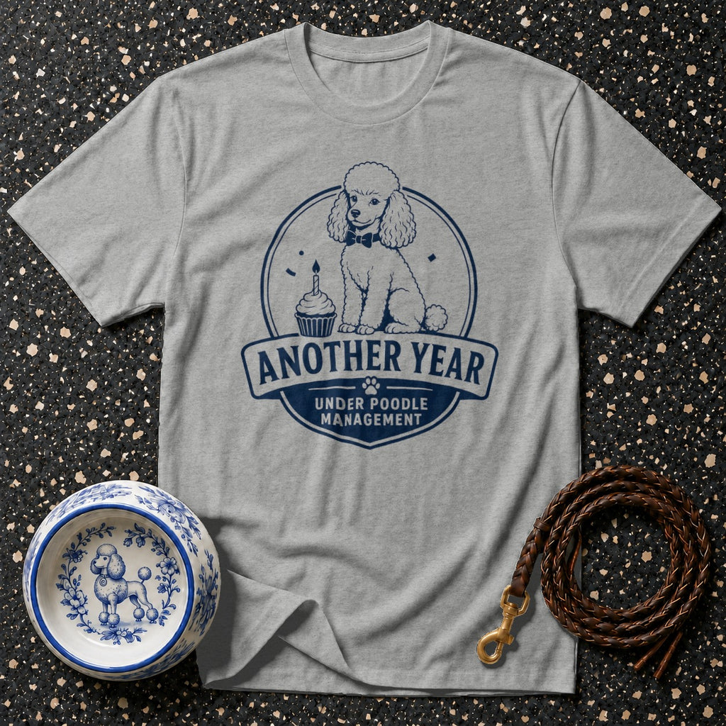 Grey t-shirt with navy poodle graphic and "Another Year Under Poodle Management" text.