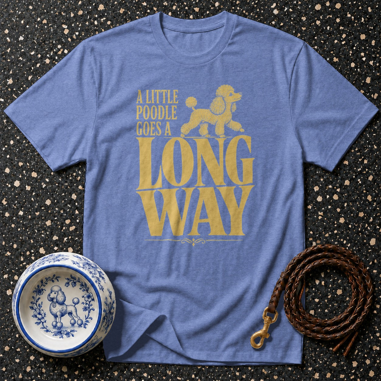 Blue t-shirt with yellow text and poodle graphic saying "A LITTLE POODLE GOES A LONG WAY."