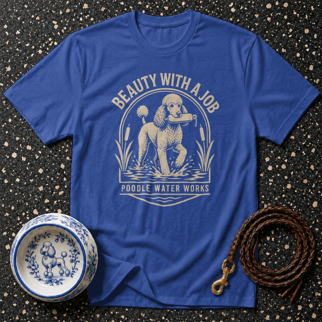 Royal blue t-shirt with a graphic of a poodle holding a stick in water.