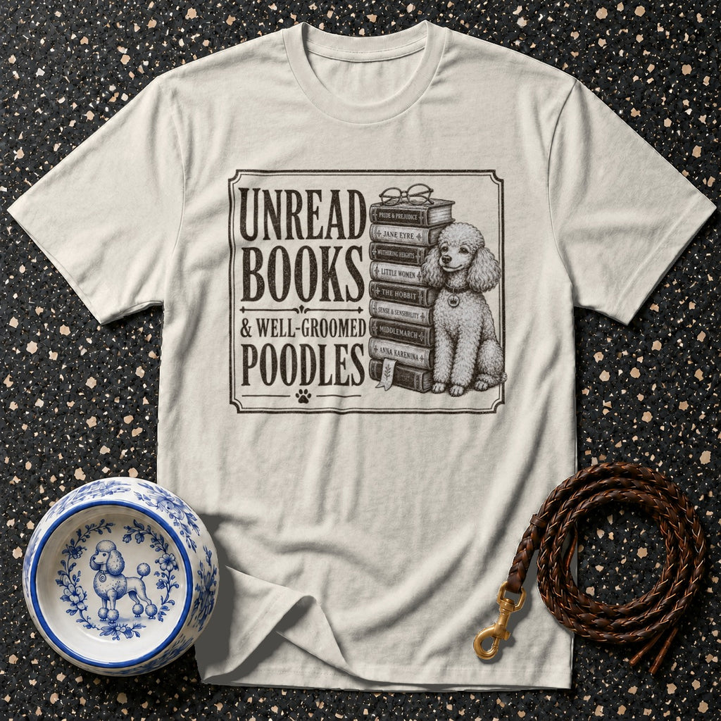 T-shirt with "Unread Books & Well-Groomed Poodles" text and poodle sitting on books.