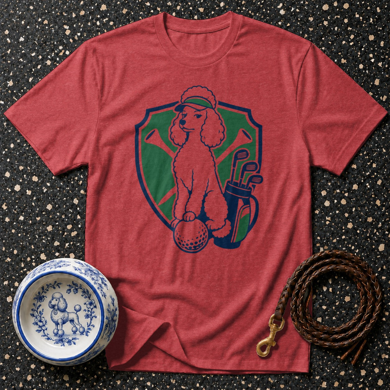 Red t-shirt with graphic of a poodle playing golf.