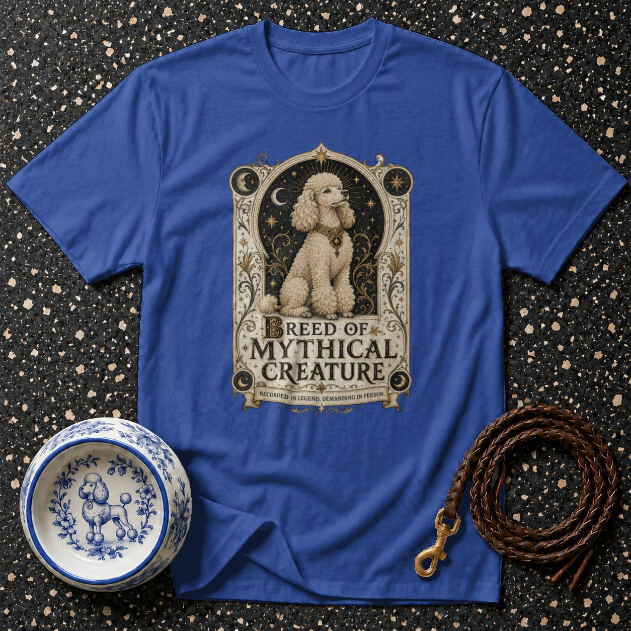 Royal blue t-shirt with a white poodle graphic and text "BREED OF MYTHICAL CREATURE".