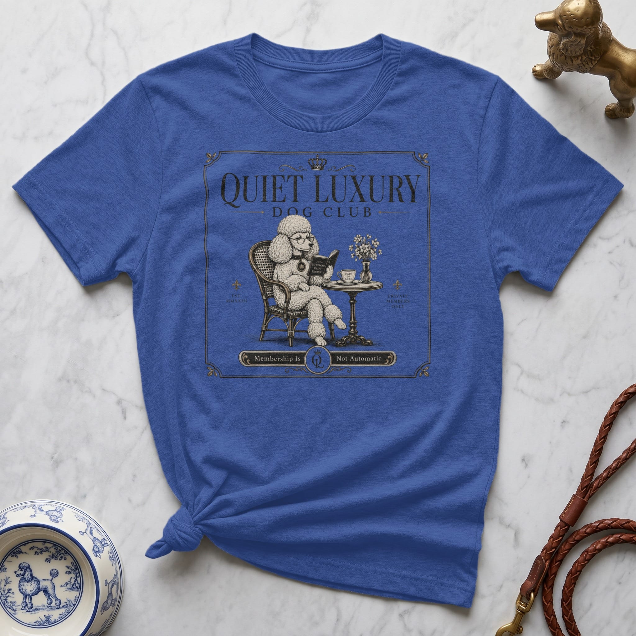 Blue t-shirt with "Quiet Luxury Dog Club" graphic and a poodle reading.