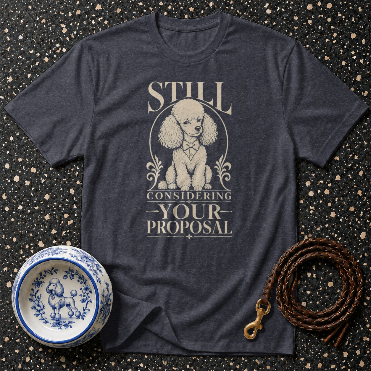 T-shirt with a poodle graphic and text "STILL CONSIDERING YOUR PROPOSAL".