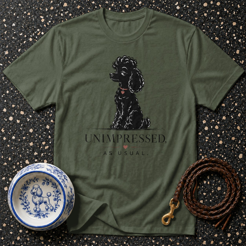 Olive t-shirt with a black poodle illustration and text "UNIMPRESSED, AS USUAL."