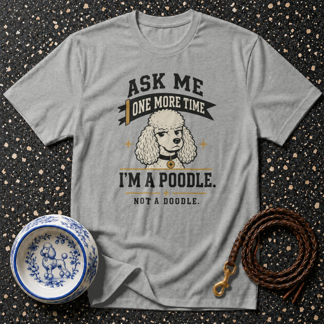 Gray t-shirt with a graphic of a poodle and text "Ask Me One More Time, I'm a Poodle. Not a Doodle."