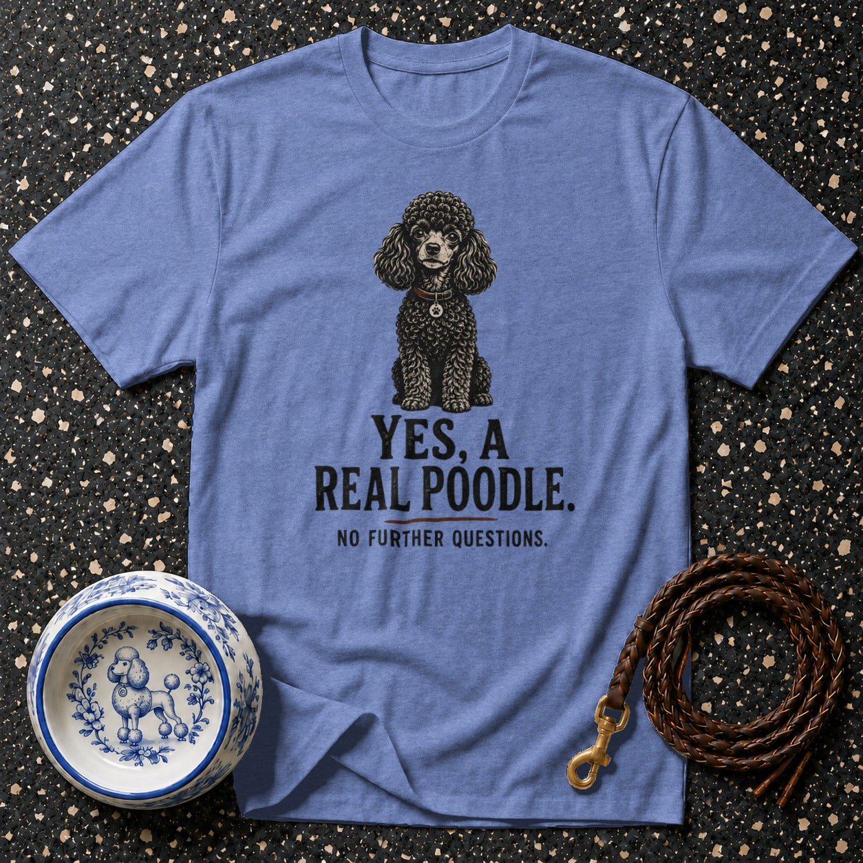 Blue t-shirt with black poodle graphic. Text reads "YES, A REAL POODLE. NO FURTHER QUESTIONS."