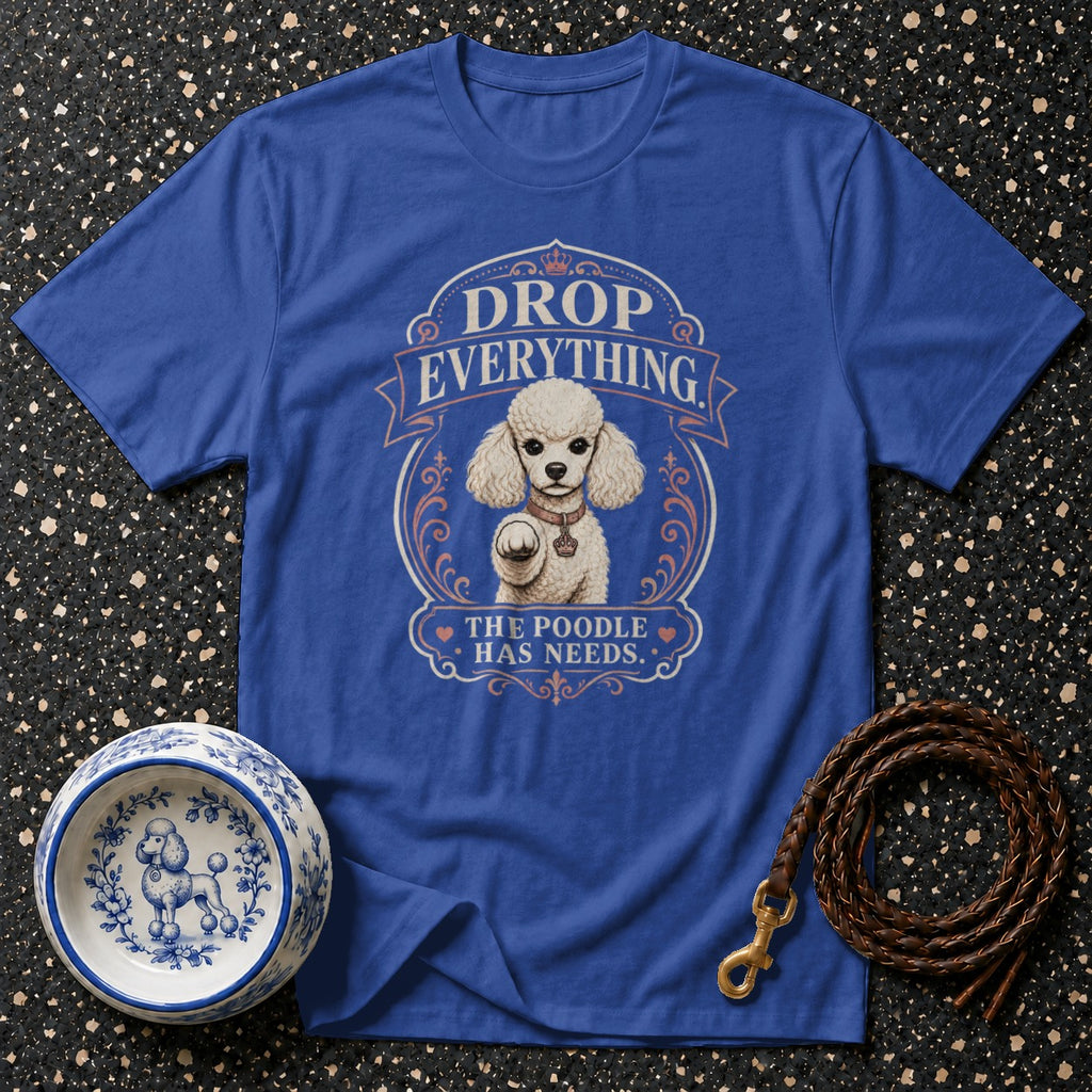 Blue t-shirt with "DROP EVERYTHING THE POODLE HAS NEEDS" and a poodle graphic.