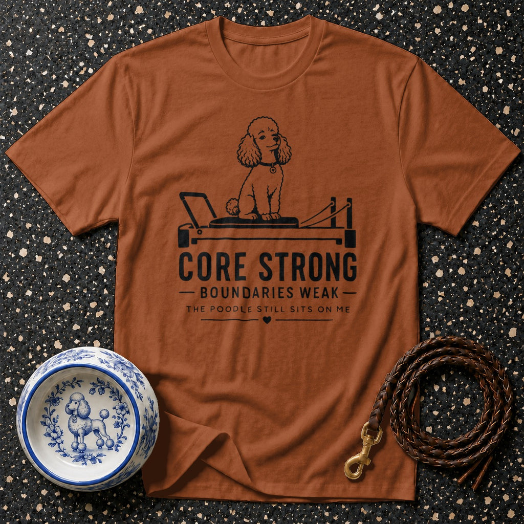 T-shirt with poodle on a reformer, text reads "CORE STRONG".
