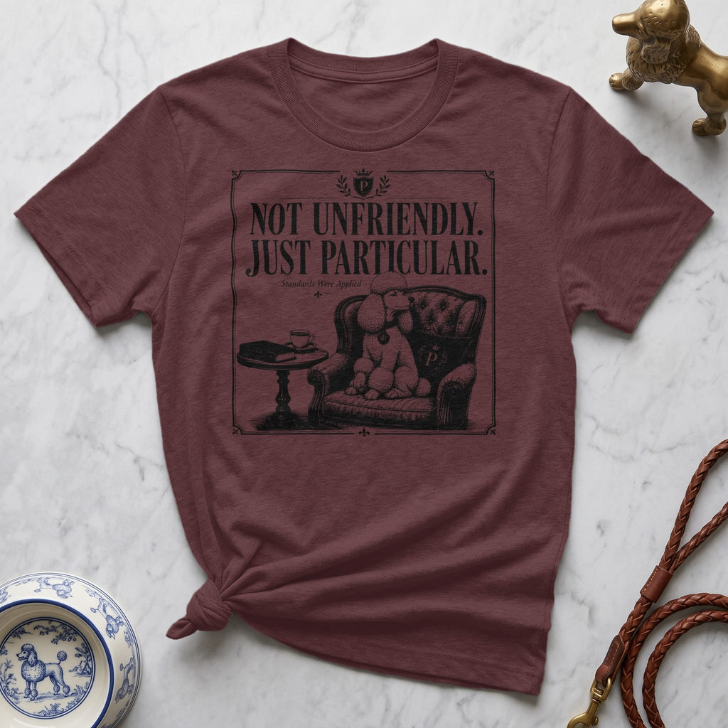 Maroon t-shirt with "Not Unfriendly. Just Particular." text and a poodle illustration.