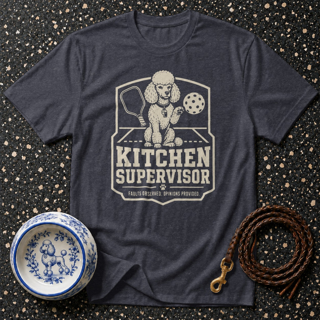 Dark t-shirt features a distressed graphic of a poodle with pickleball gear and text reading "Kitchen Supervisor".