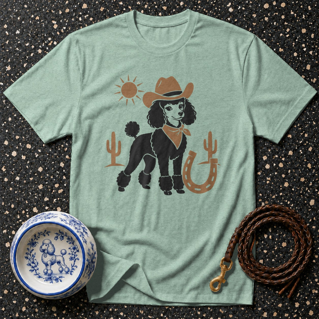 Light mint t-shirt with a black poodle wearing a cowboy hat and bandana on the front.