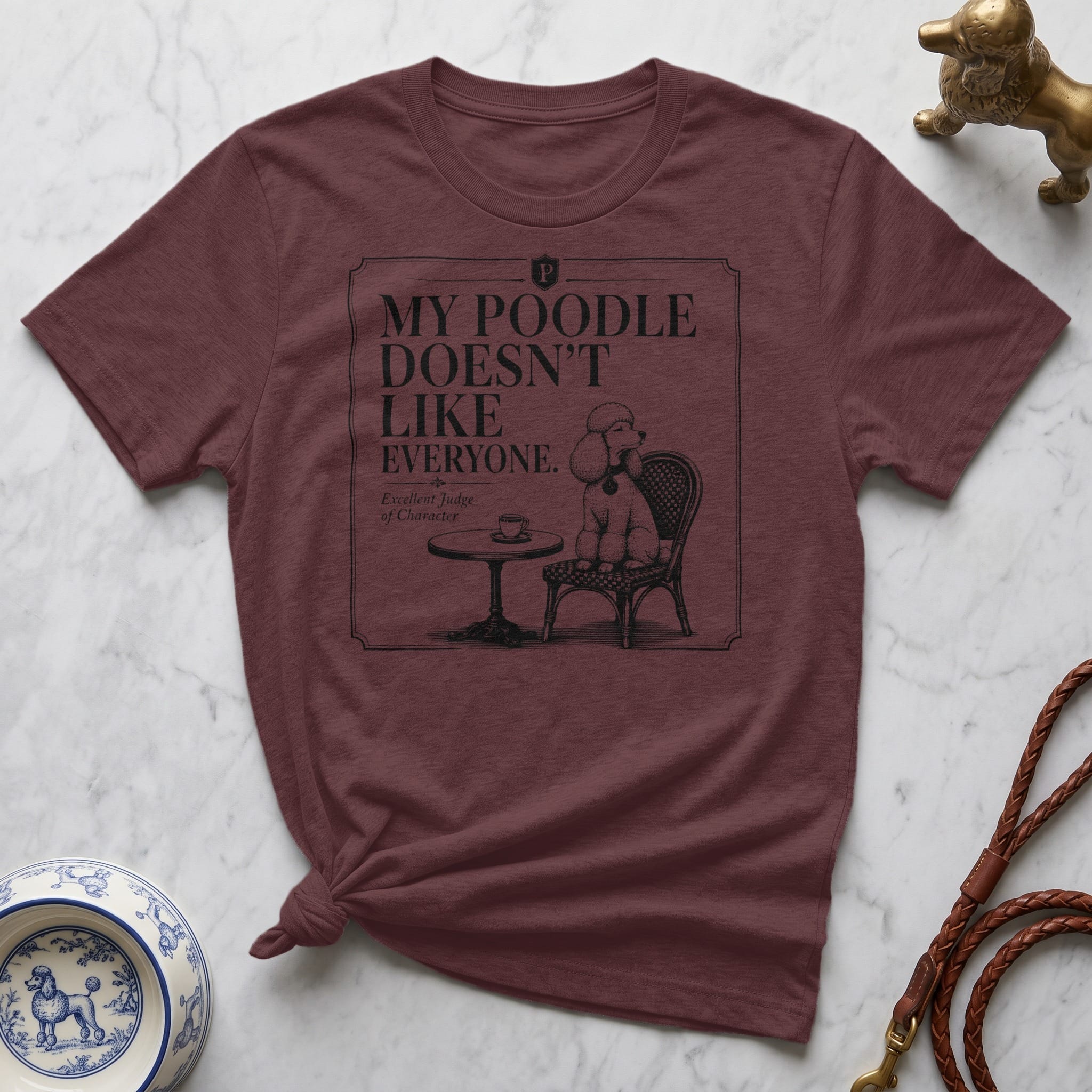 Burgundy t-shirt with a poodle graphic and "My Poodle Doesn't Like Everyone" text.