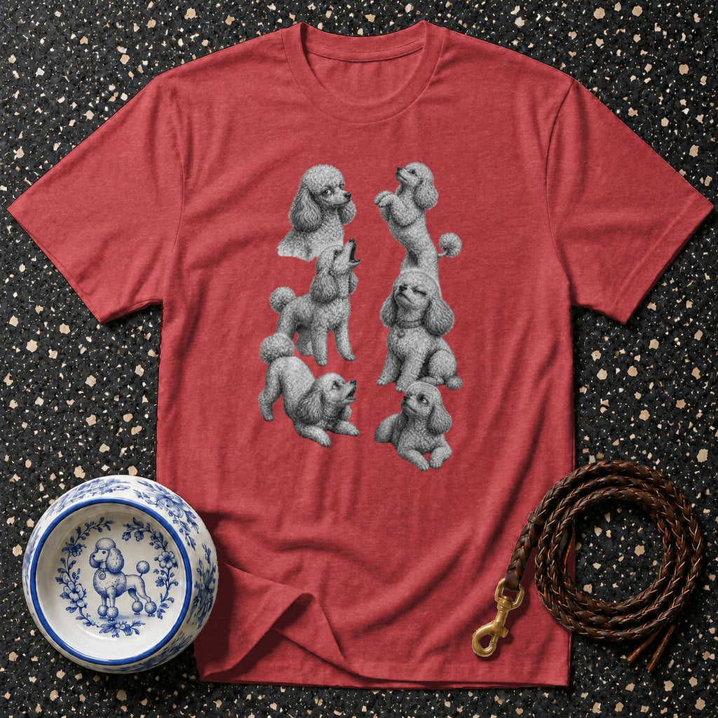 Red t-shirt with a graphic print of multiple grey poodles in various poses and a blue and white poodle bowl.