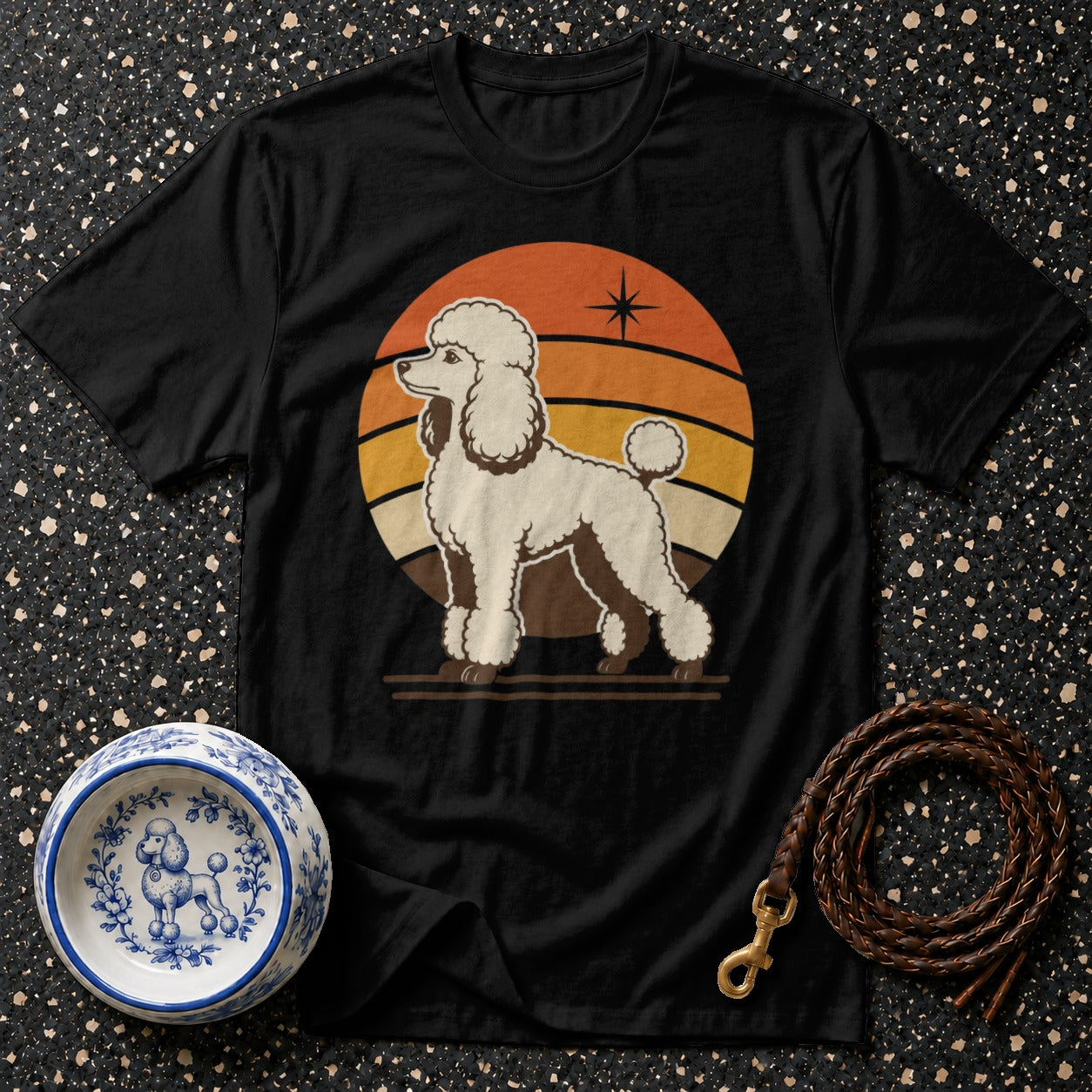 Black t-shirt with a white poodle graphic and a retro sunset design.