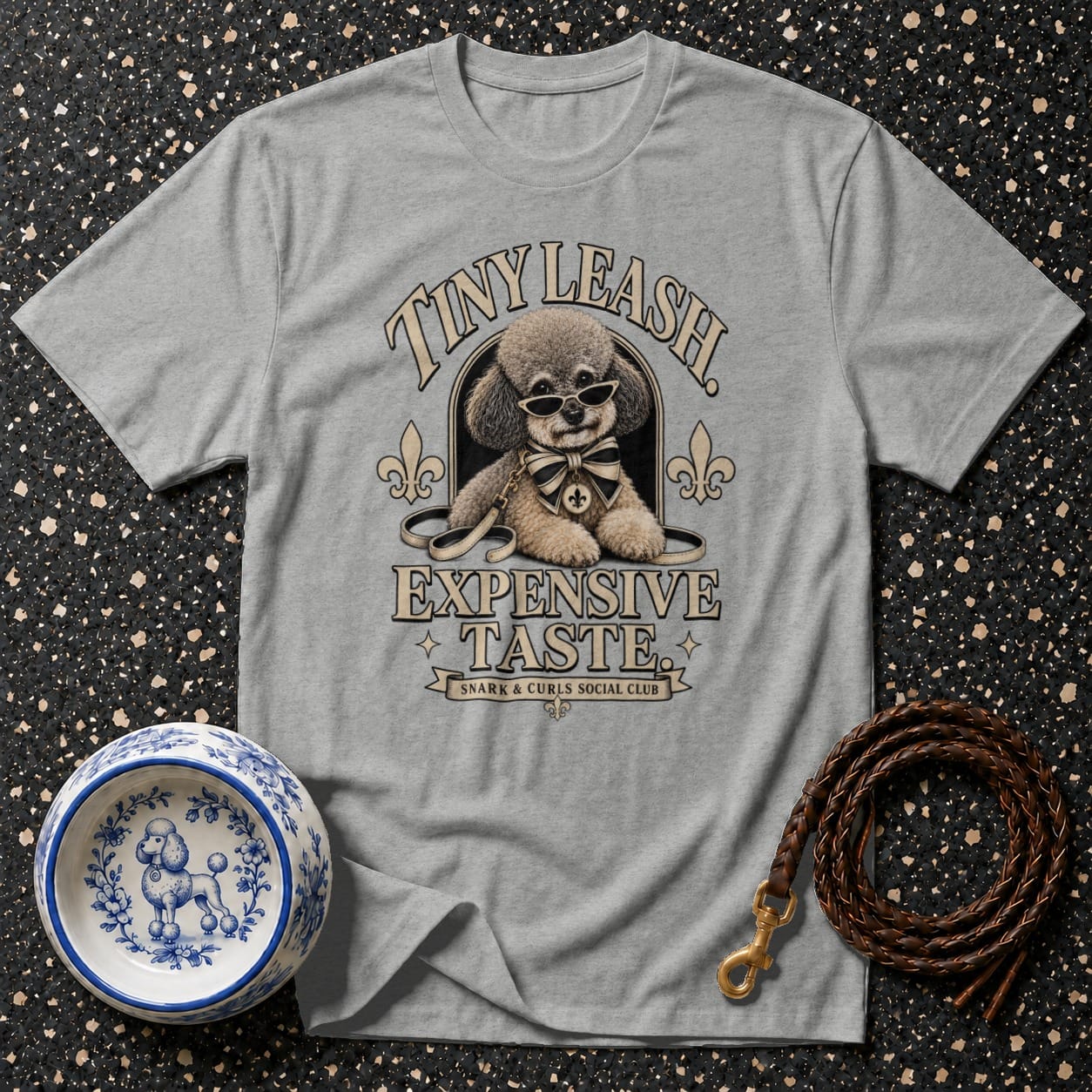 Grey t-shirt with poodle wearing sunglasses, with text "Tiny Leash Expensive Taste Snark & Curls Social Club".
