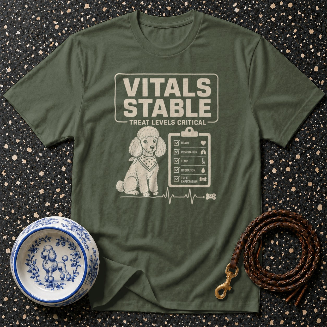 Green t-shirt with poodle graphic and "Vitals Stable Treat Levels Critical" text.