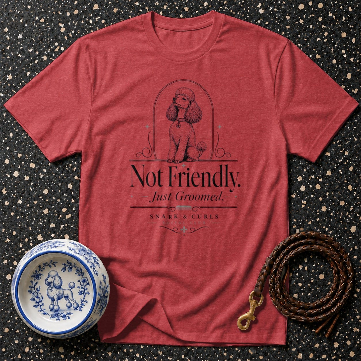 Red t-shirt with poodle graphic and text 'Not Friendly. Just Groomed. Snark & Curls.'