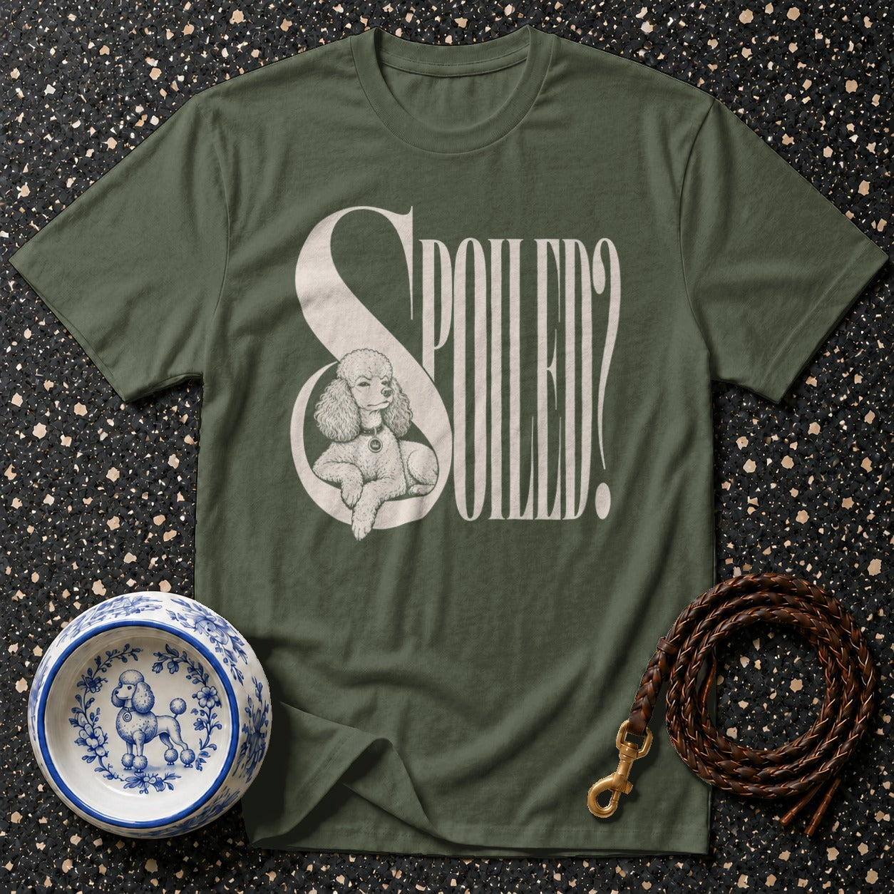 Green t-shirt with "SPOILE?D" text and poodle graphic, dog bowl, and leash.