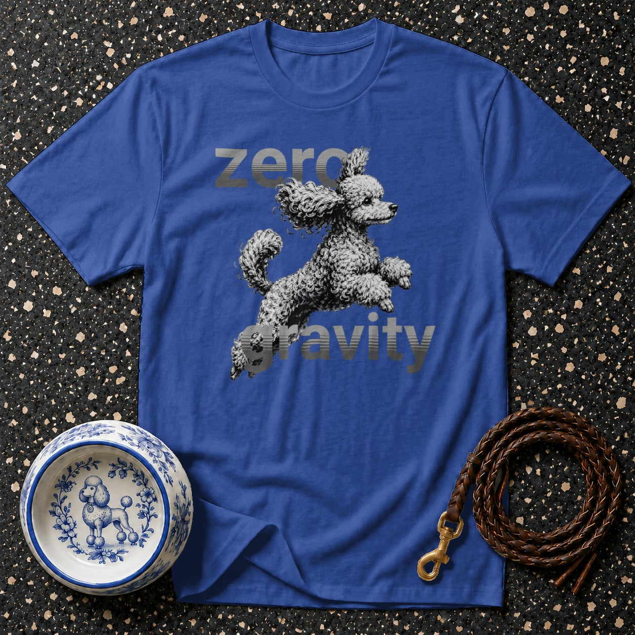 Blue t-shirt with a poodle graphic and "zero gravity" text.