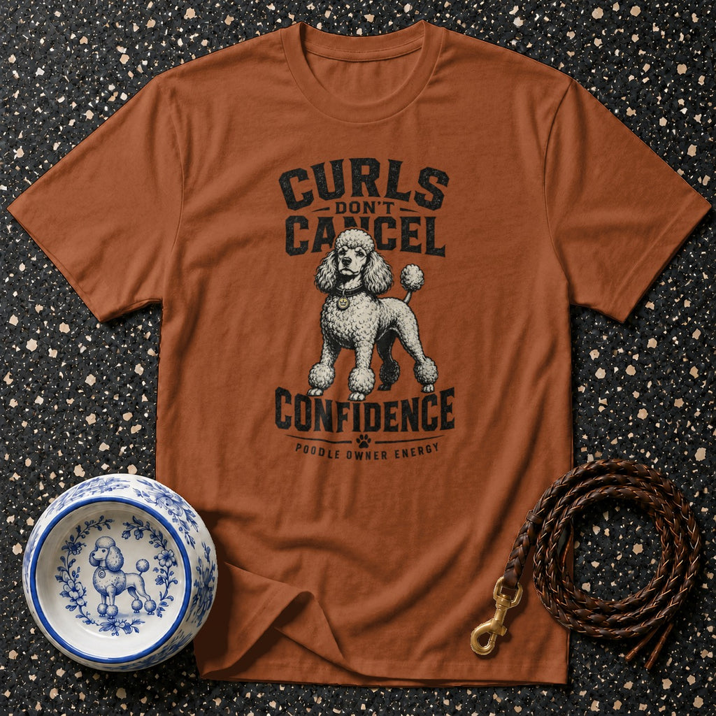 Brown t-shirt with poodle graphic and text: Curls Don't Cancel Confidence.