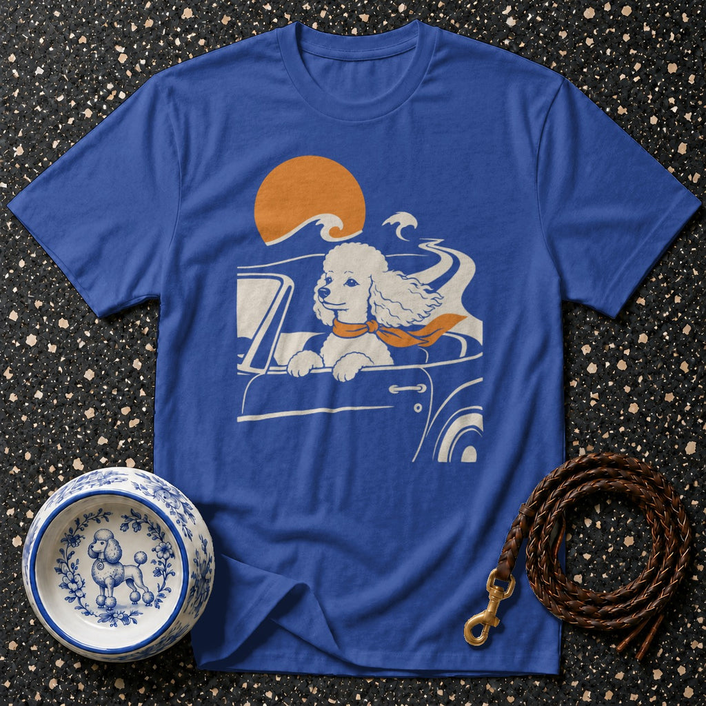 Blue t-shirt with a poodle driving a car, orange scarf, and sun.