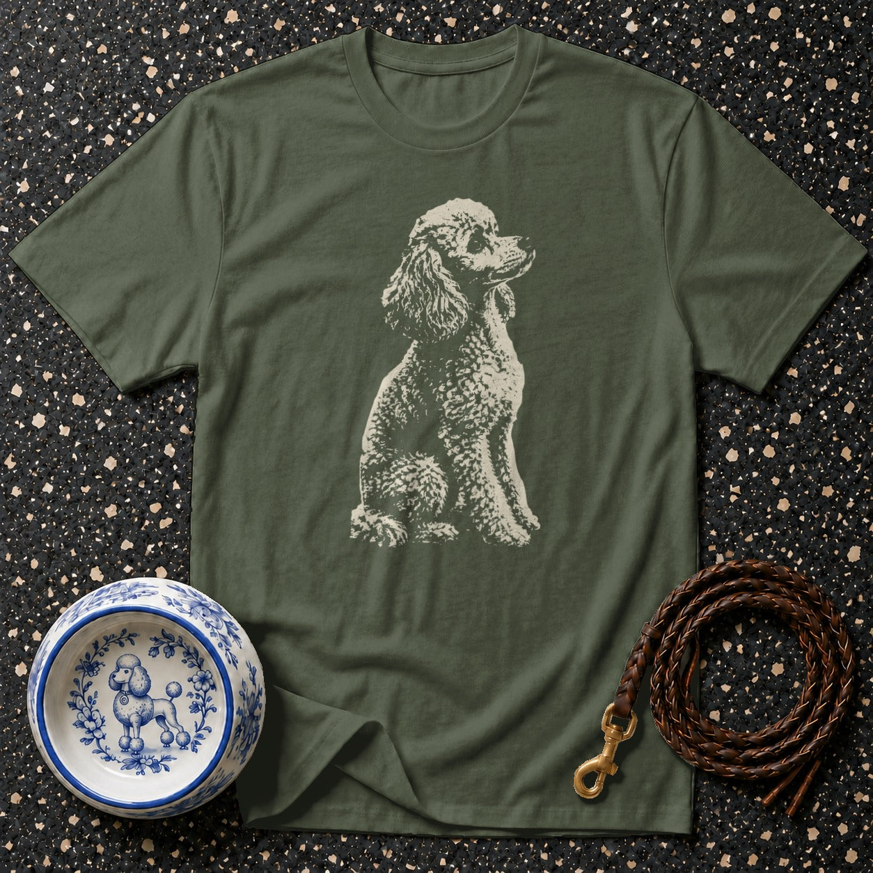 Olive green t-shirt with poodle graphic, decorative bowl, and leather leash.