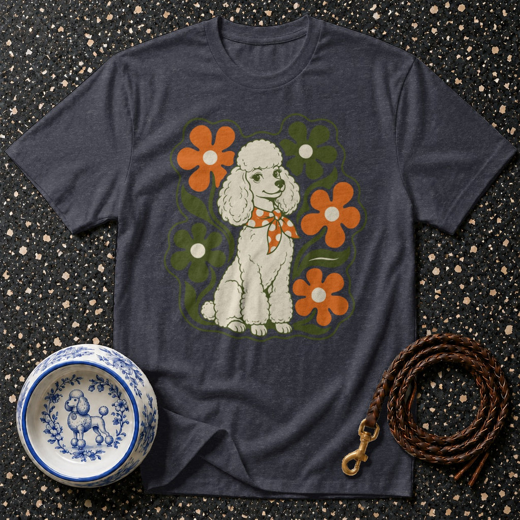 T-shirt with retro white poodle design surrounded by orange and green flowers.