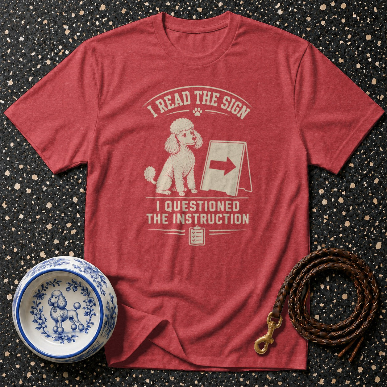 Red t-shirt with poodle graphic and text: I READ THE SIGN, I QUESTIONED THE INSTRUCTION.
