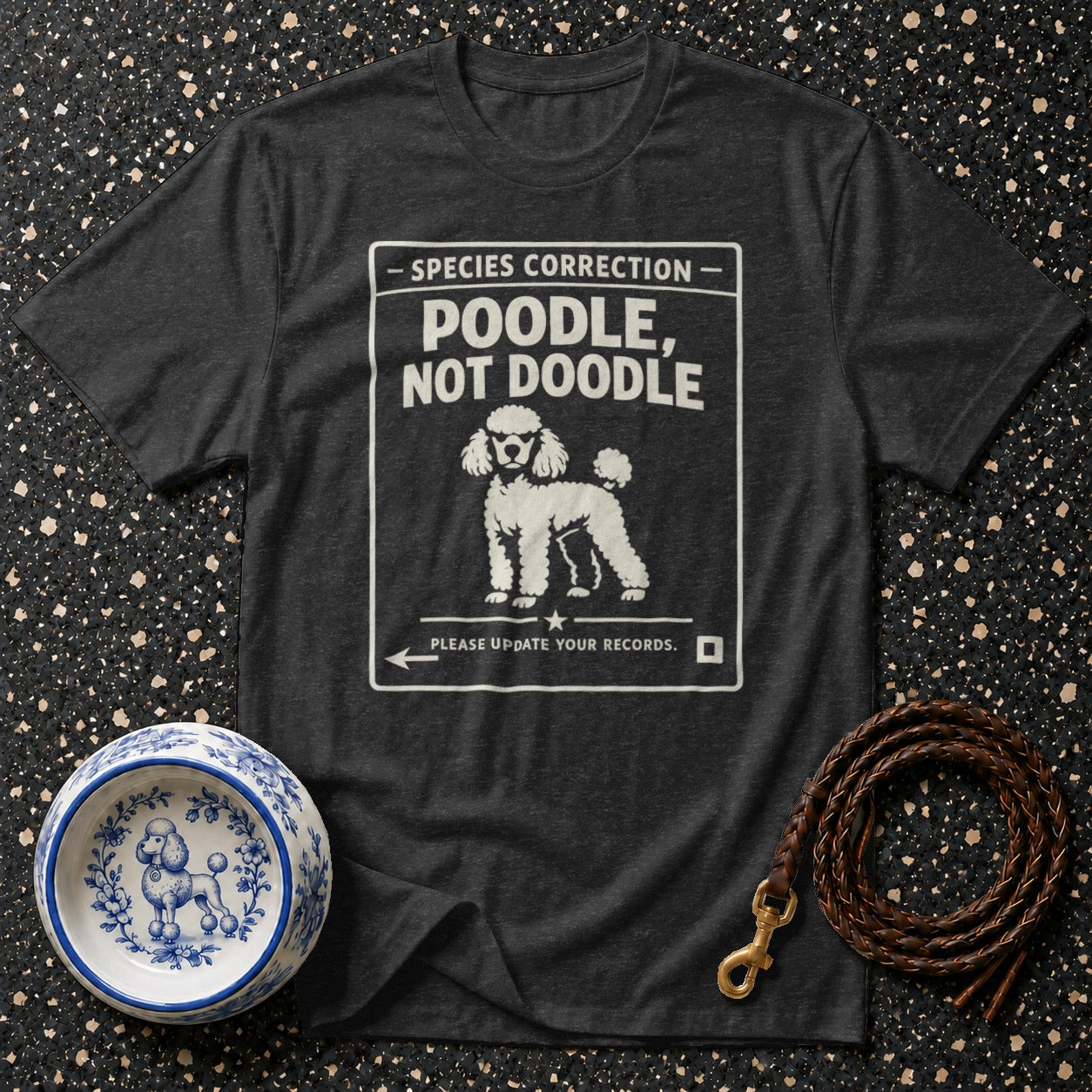 Dark t-shirt with white text: "SPECIES CORRECTION POODLE, NOT DOODLE" and a poodle drawing.