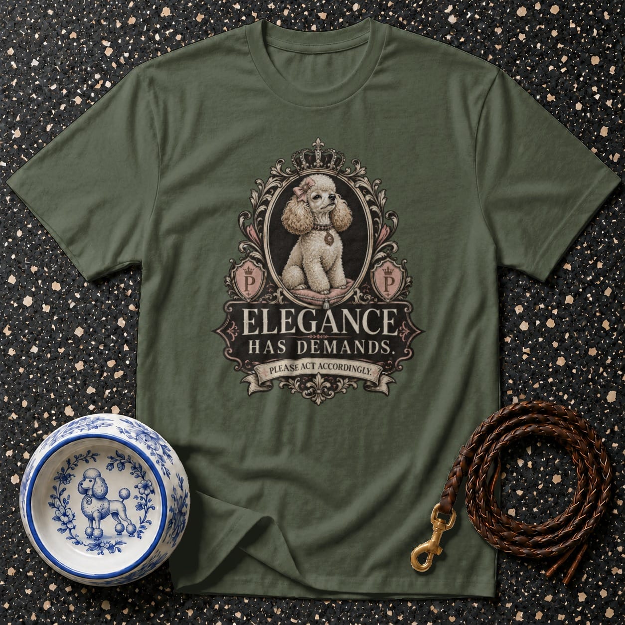 Green t-shirt featuring a framed poodle with text "Elegance Has Demands. Please Act Accordingly."