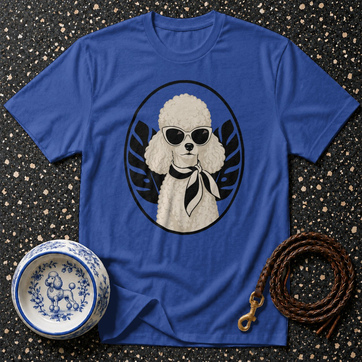 Blue t-shirt with a white poodle wearing sunglasses and a scarf.