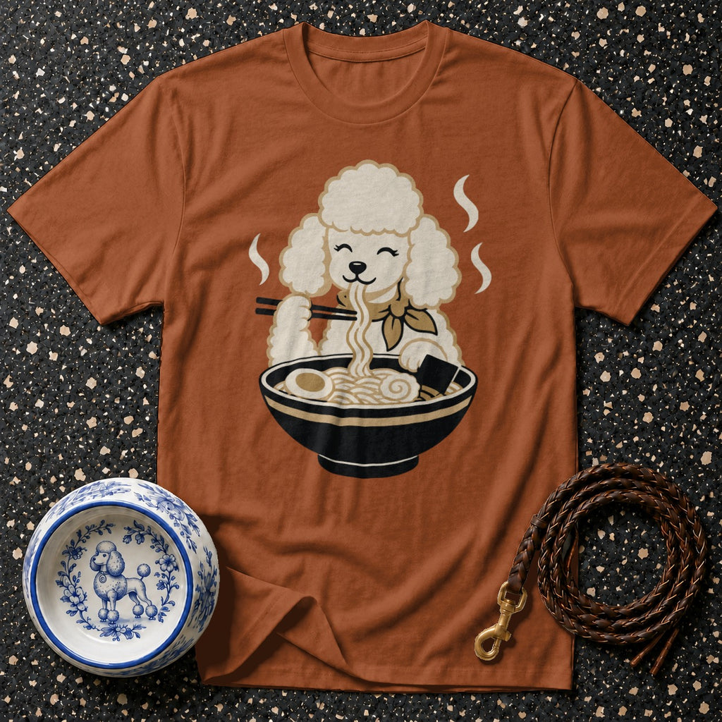 Brown t-shirt with a cartoon poodle eating ramen noodles from a bowl.