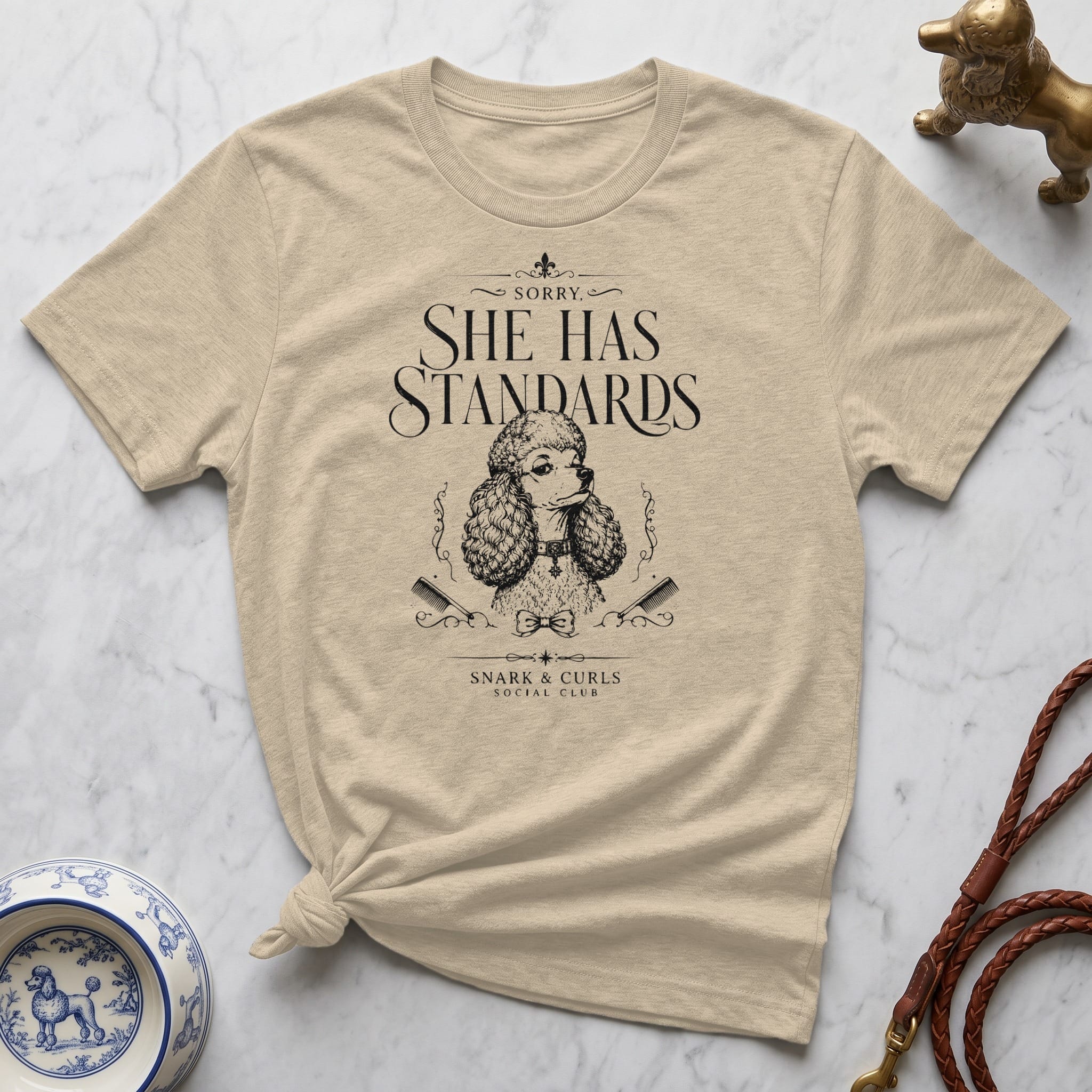 T-shirt with "SHE HAS STANDARDS" and poodle graphic.