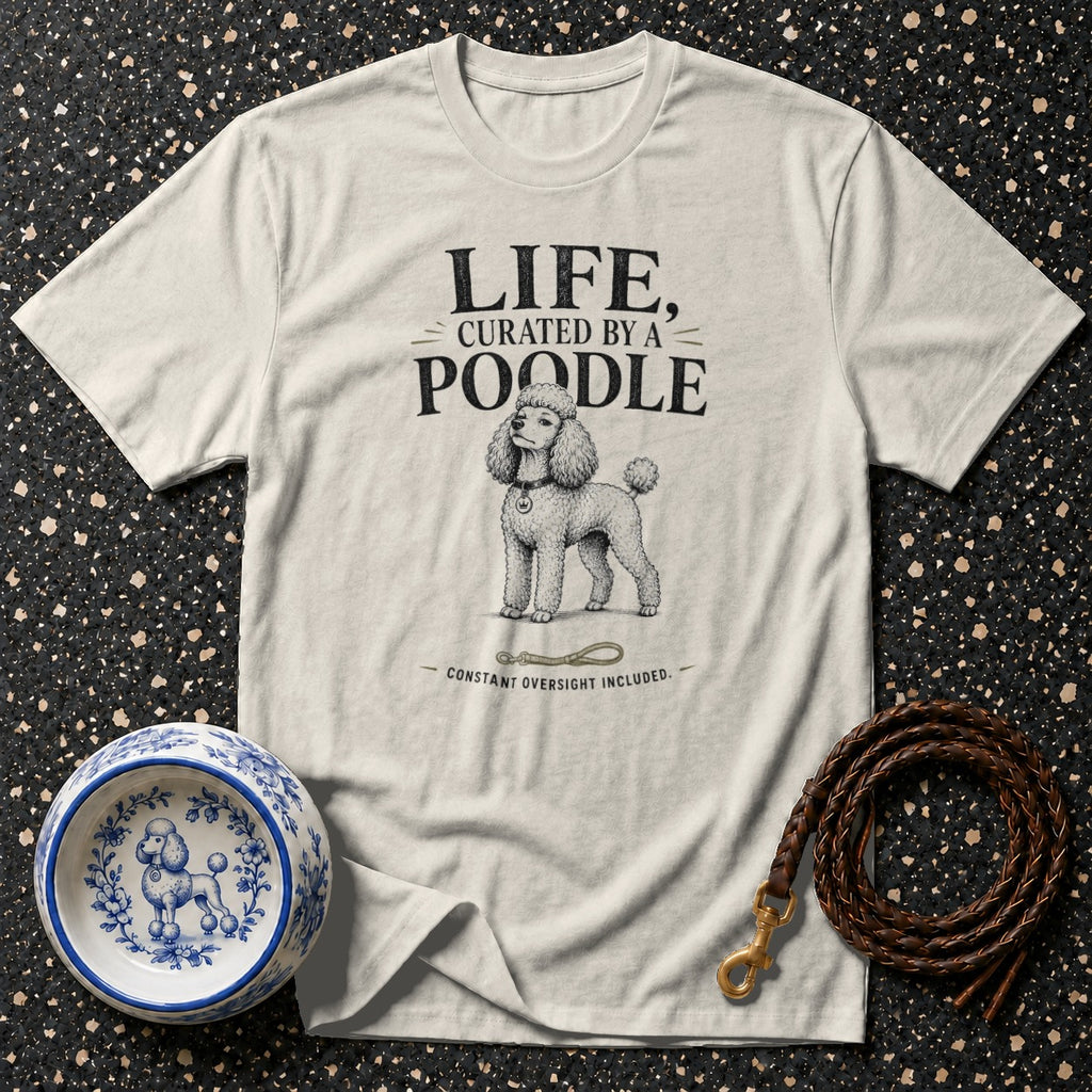 Cream t-shirt with text "LIFE, CURATED BY A POODLE" and a poodle illustration.